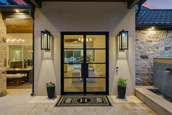 a view of a entryway door of the room