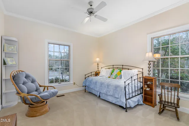 a bedroom with furniture and windows
