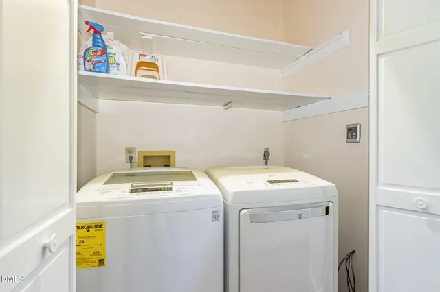 a living room filled with furniture and a large window