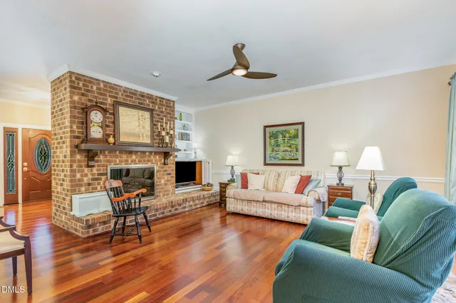 a living room with furniture or fireplace and a wooden floor