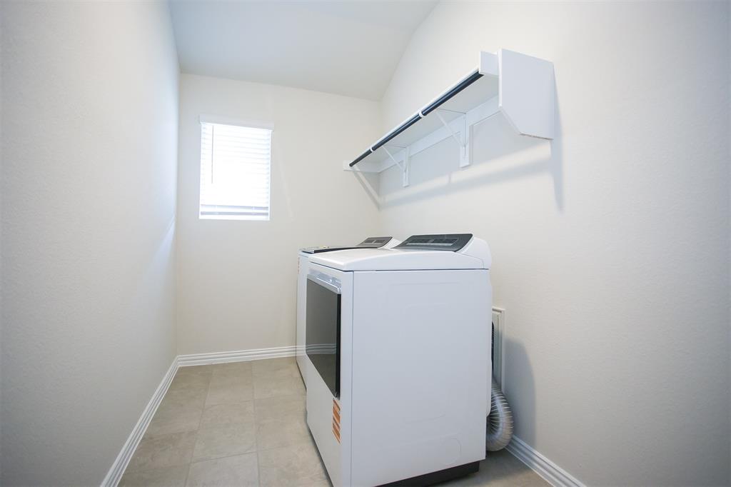 404 Castle Road Sherman, TX 75092 - Photo 13 of 25 a utility room with dryer and washer