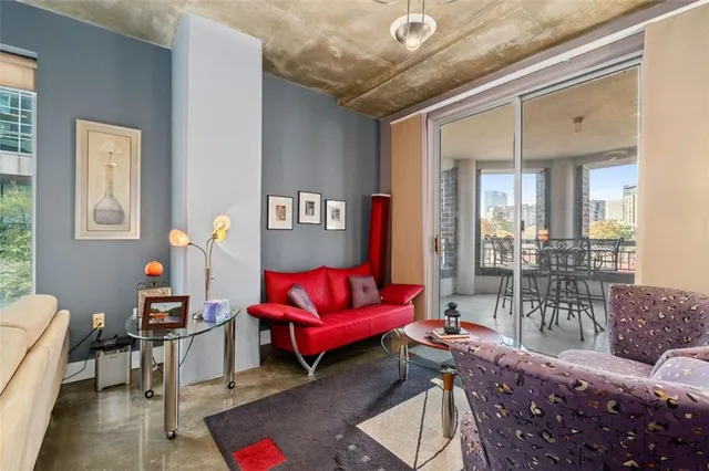 a living room with furniture and a table
