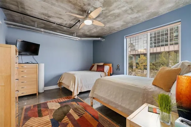 a bed room with a bed and a chandelier