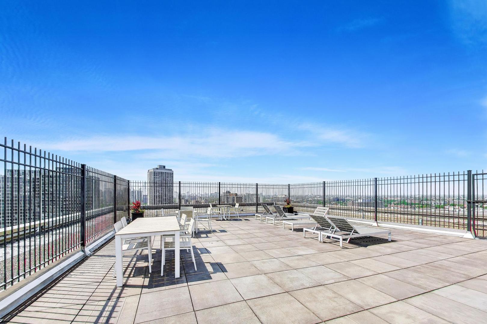 2930 North Sheridan Road, Unit 702 Chicago, IL 60657 - Photo 21 of 25 a view of a terrace with chairs