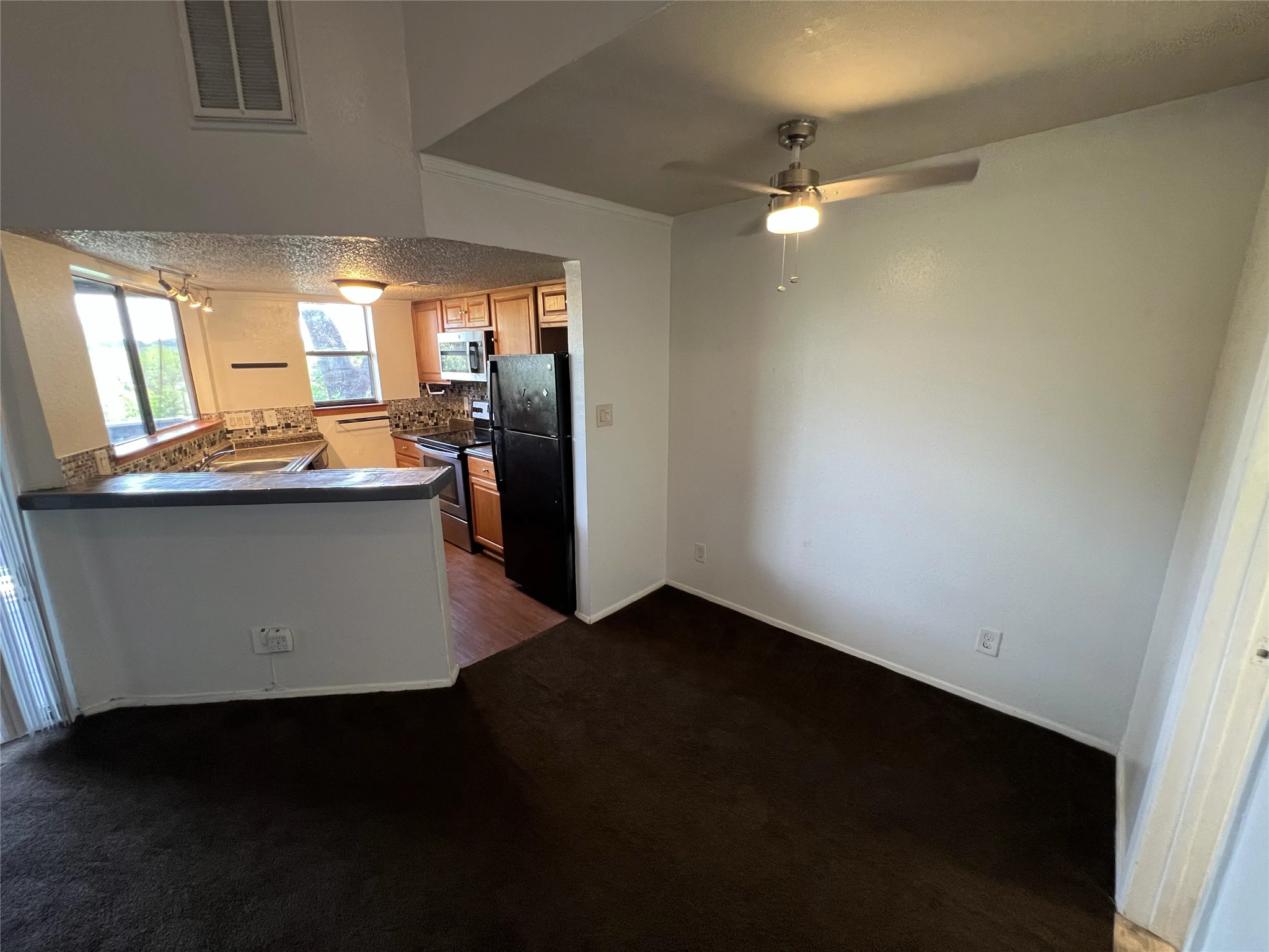 2500 Burleson Road, Unit 622 Austin, TX 78741 - Photo 17 of 17 An open floorplan seamlessly connects the kitchen and living areas, offering effortless daily living.