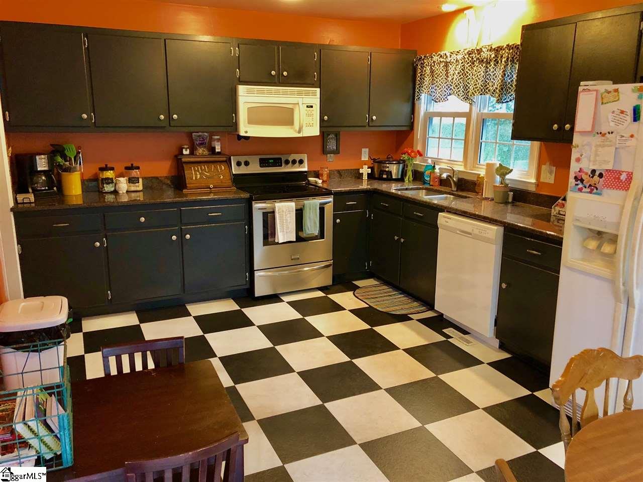 602 Cedar Street Clinton, SC 29325 - Photo 9 of 11 Featuring granite flooring, black appliances, and stylist flooring.