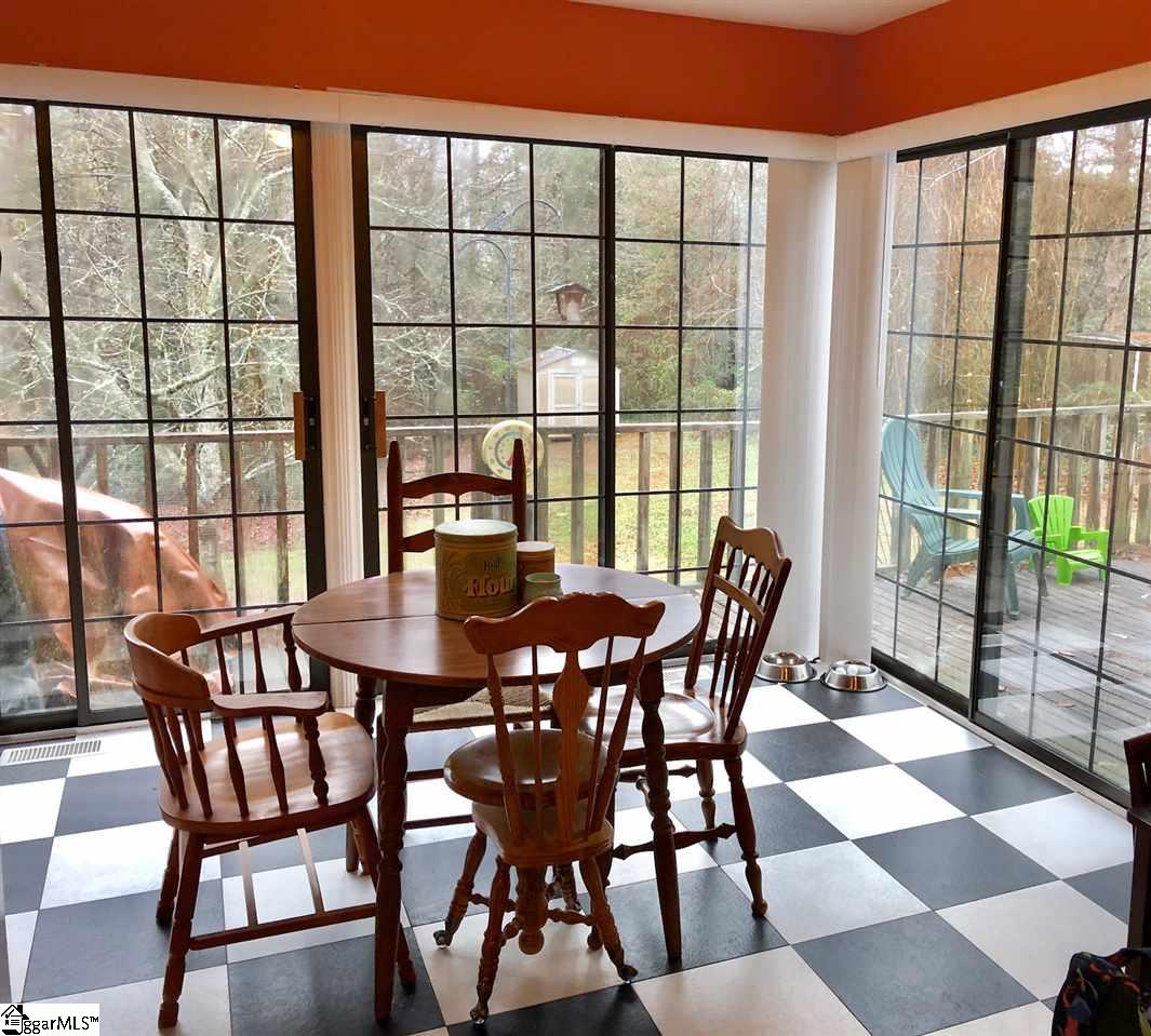 602 Cedar Street Clinton, SC 29325 - Photo 10 of 11 Breakfast area in kitchen, featuring floor length sliding glass doors with beautiful view to backyard and access to patio.