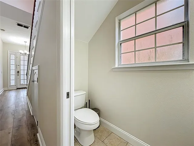 a view of a hallway with windows