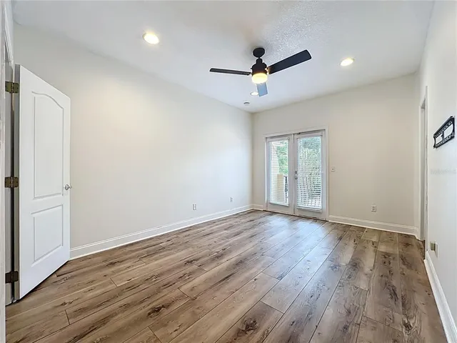 a bathroom with a sink a large mirror and a shower