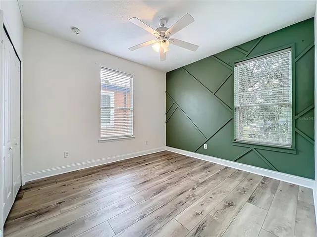 a front view of a house with a yard outdoor seating and barbeque oven