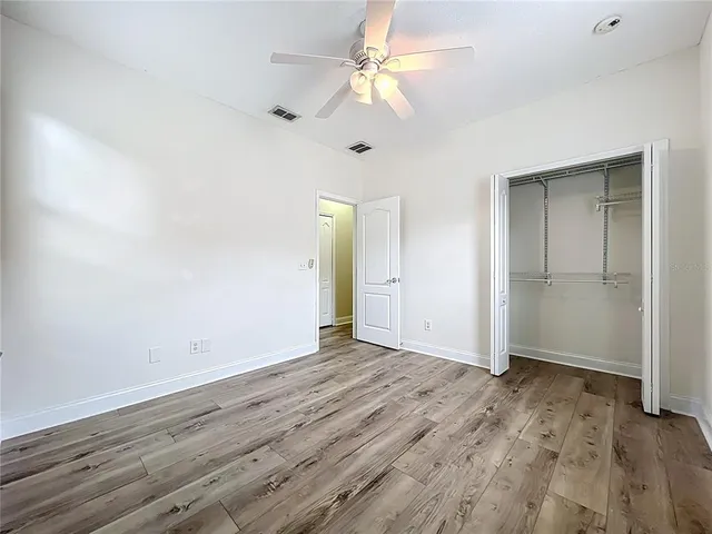 a view of a house with backyard and a patio