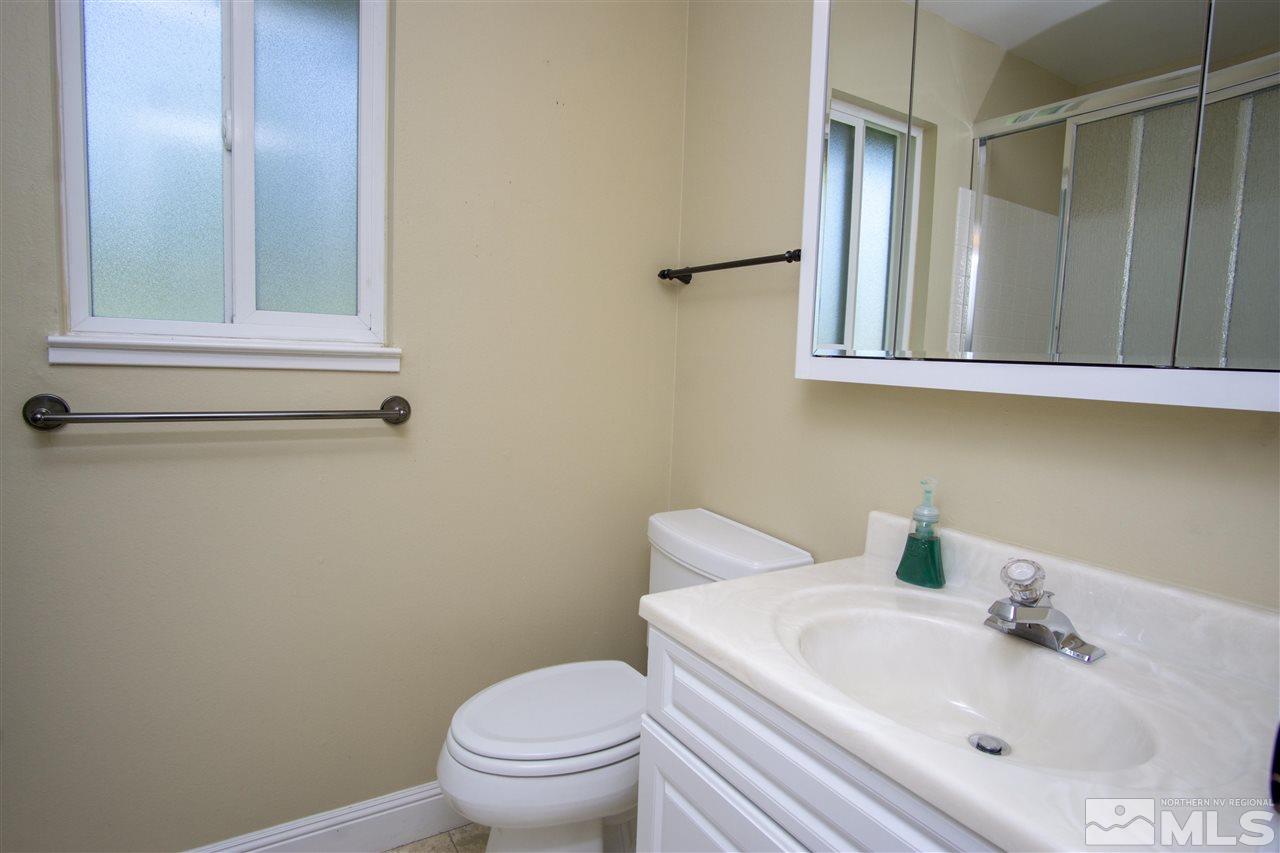 1245 Searchlite Court Reno, NV 89503 - Photo 16 of 26 a bathroom with a sink and a toilet