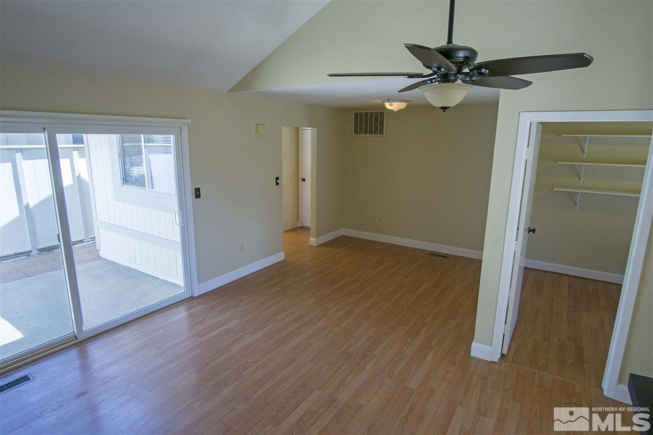 1245 Searchlite Court Reno, NV 89503 - Photo 6 of 26 wooden floor in an empty room with a window