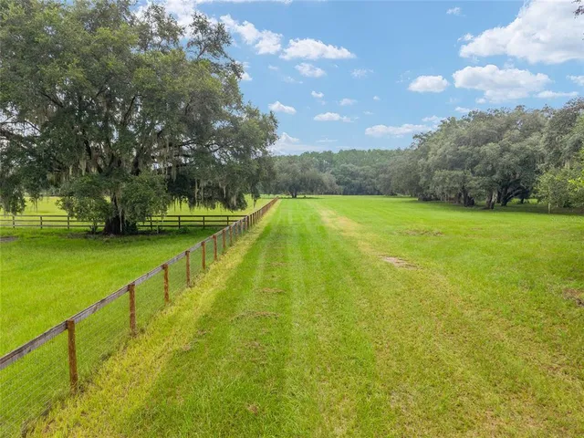 a view of swimming pool from a yard