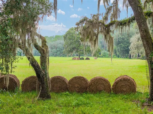 a view of swimming pool and outdoor seating