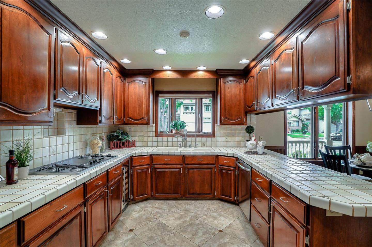669 Regas Drive Campbell, CA 95008 - Photo 14 of 59 a kitchen with stainless steel appliances granite countertop wooden cabinets a sink and dishwasher