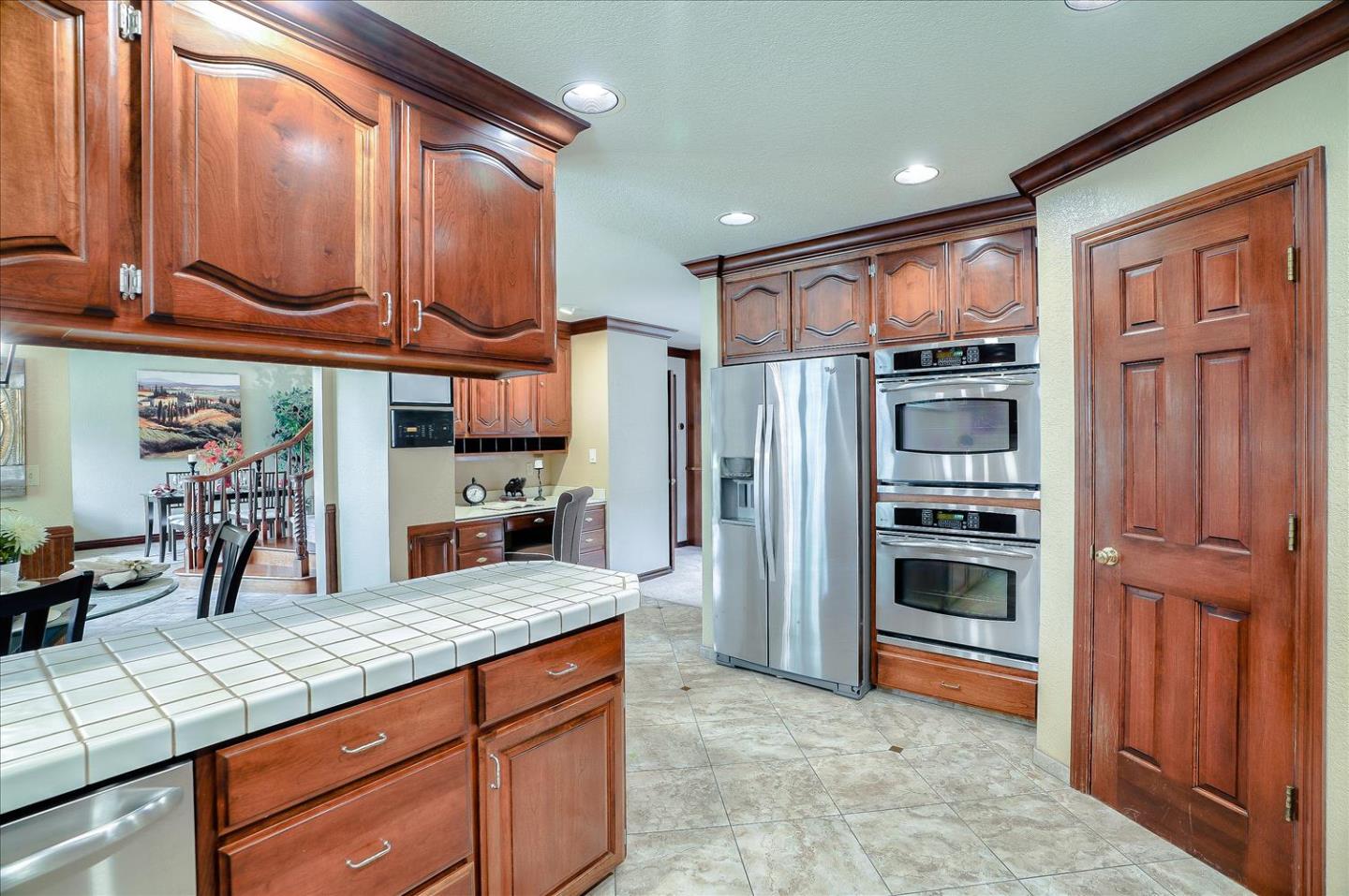 669 Regas Drive Campbell, CA 95008 - Photo 15 of 59 a kitchen with stainless steel appliances granite countertop a refrigerator and a stove top oven