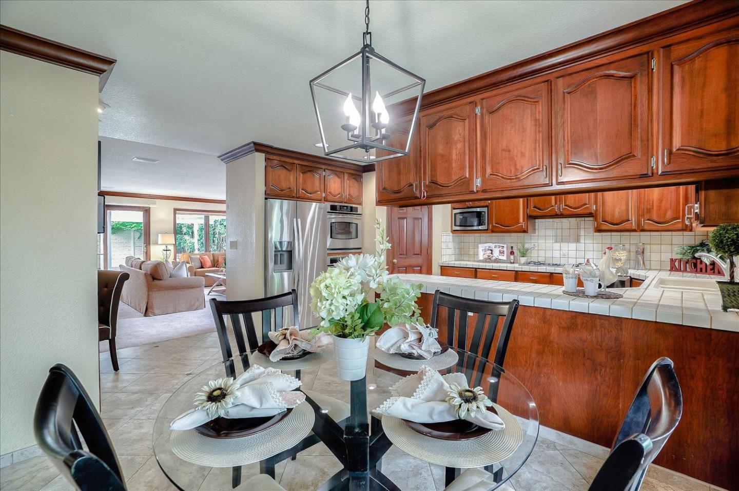 669 Regas Drive Campbell, CA 95008 - Photo 16 of 59 a dining room with furniture a rug and wooden floor