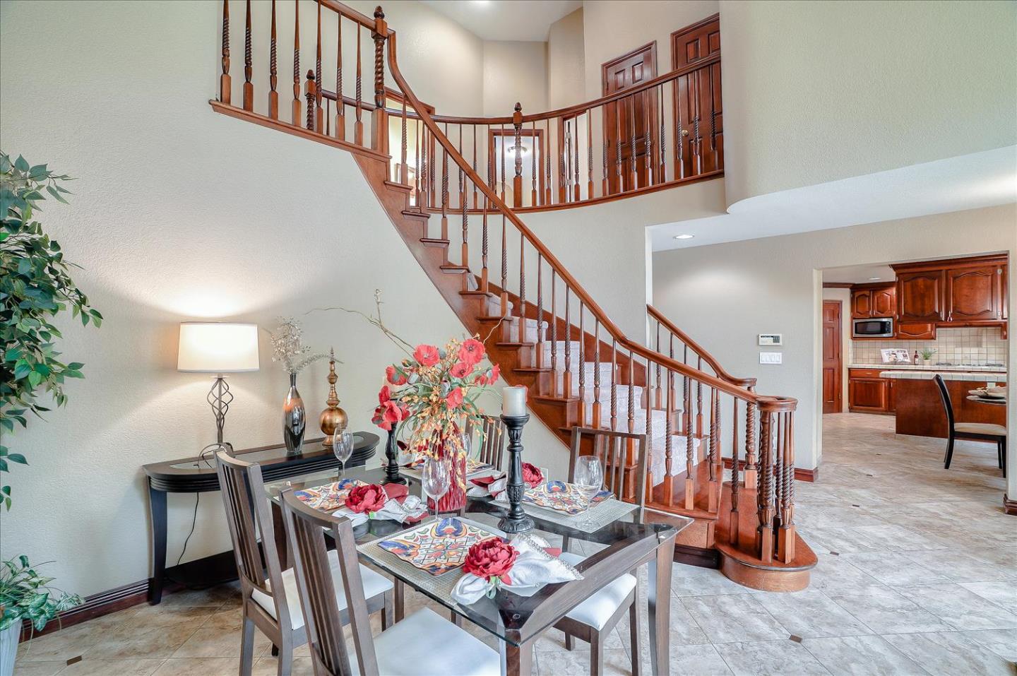 669 Regas Drive Campbell, CA 95008 - Photo 19 of 59 a living room with stairs and a dining table with wooden floor