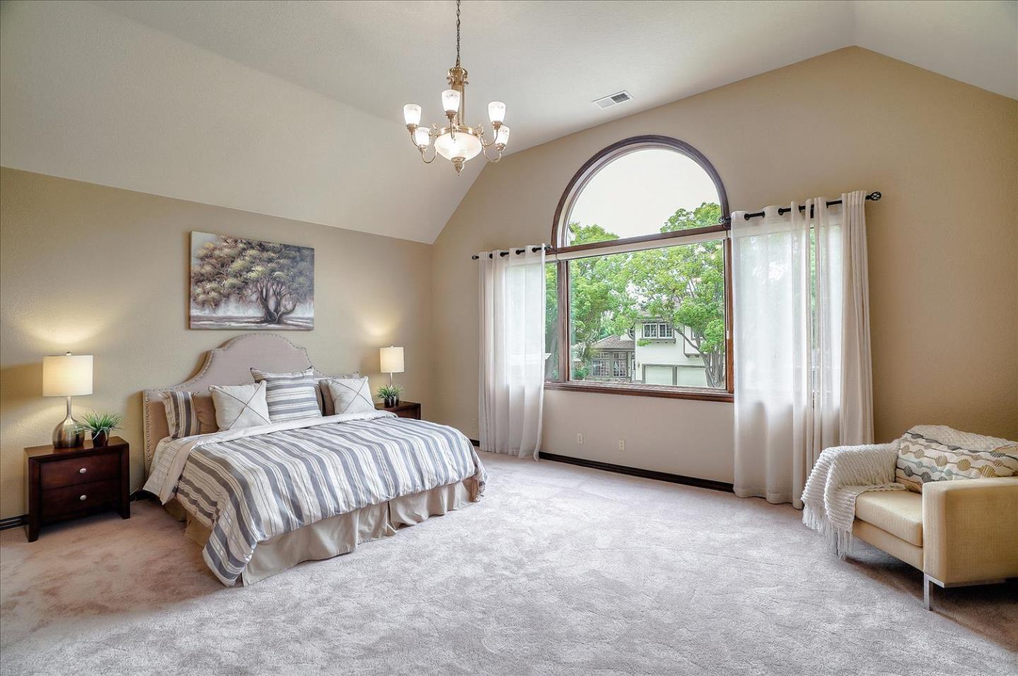 669 Regas Drive Campbell, CA 95008 - Photo 26 of 59 a spacious bedroom with a bed and a large window