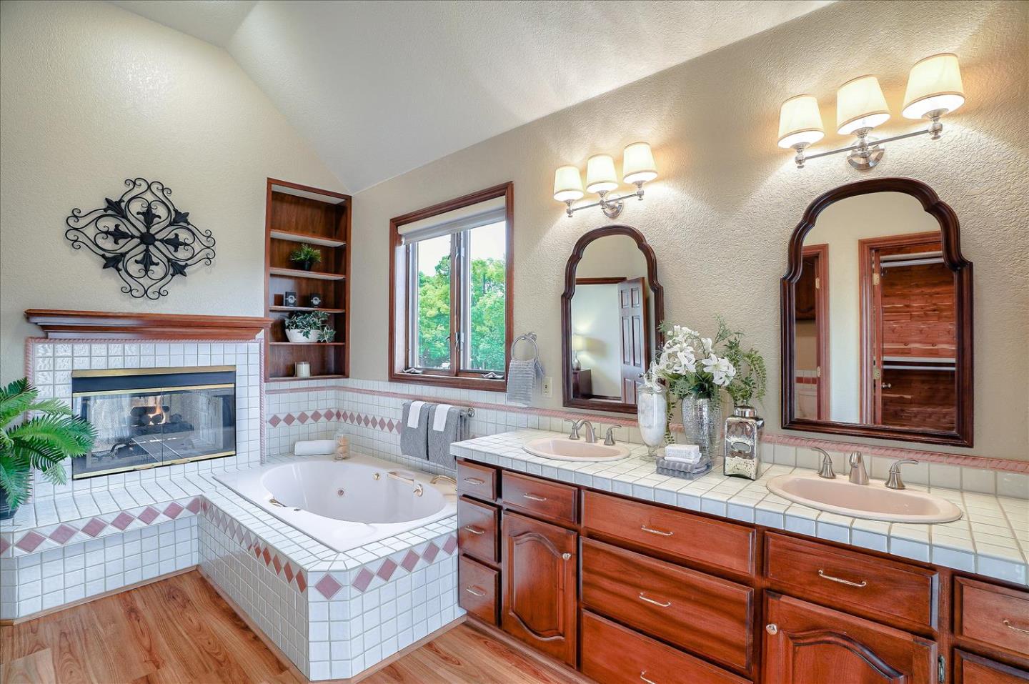 669 Regas Drive Campbell, CA 95008 - Photo 27 of 59 a spacious bathroom with a granite countertop tub a double vanity sink a window and a potted plant