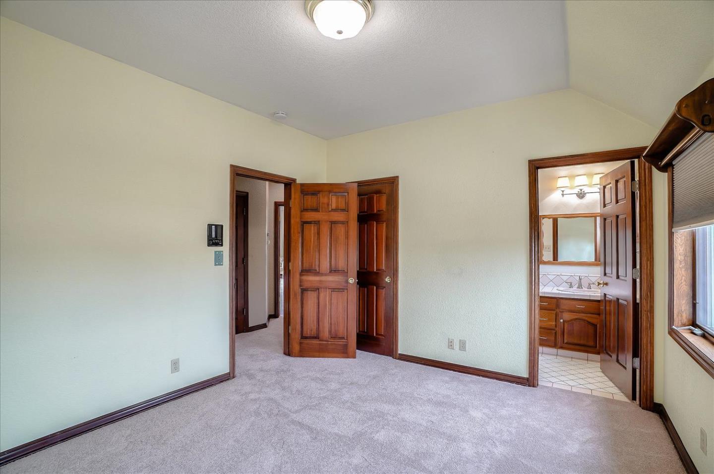 669 Regas Drive Campbell, CA 95008 - Photo 43 of 59 an empty room with closet and mirror