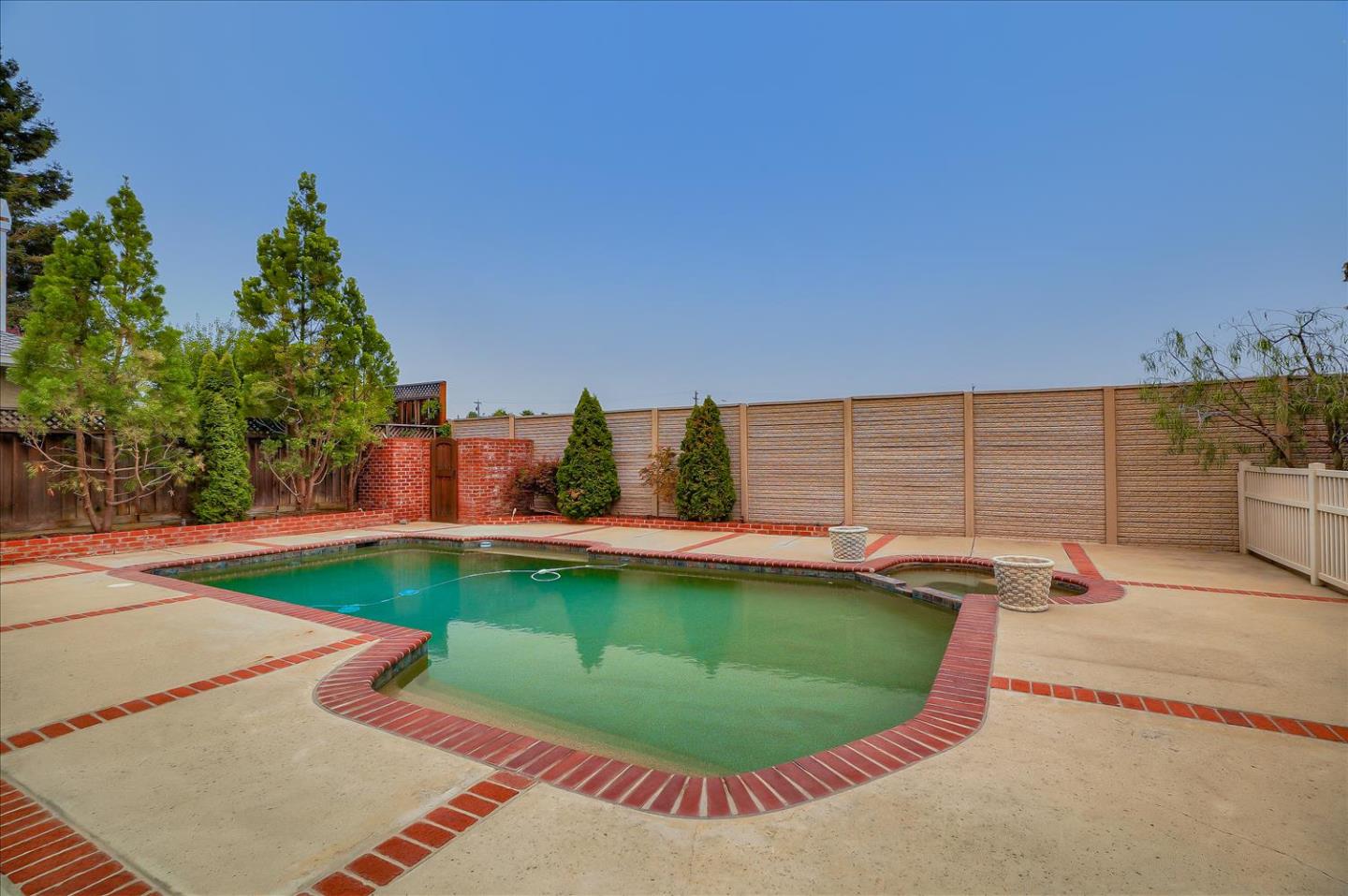 669 Regas Drive Campbell, CA 95008 - Photo 58 of 59 a view of a swimming pool with an outdoor seating