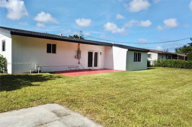 a house view with a backyard space