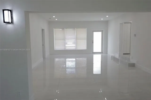 a view of a kitchen with wooden floor