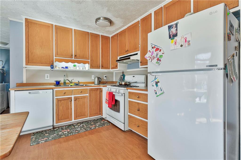8420 Cleckler Road Palmetto, GA 30268 - Photo 15 of 51 a kitchen with stainless steel appliances granite countertop a refrigerator and a sink