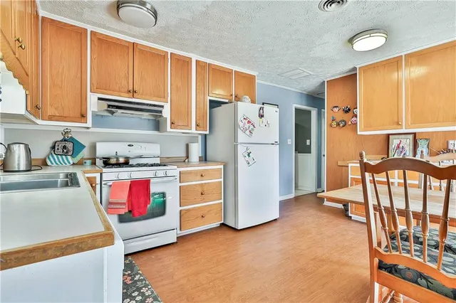 a bedroom with a bed a table and chair