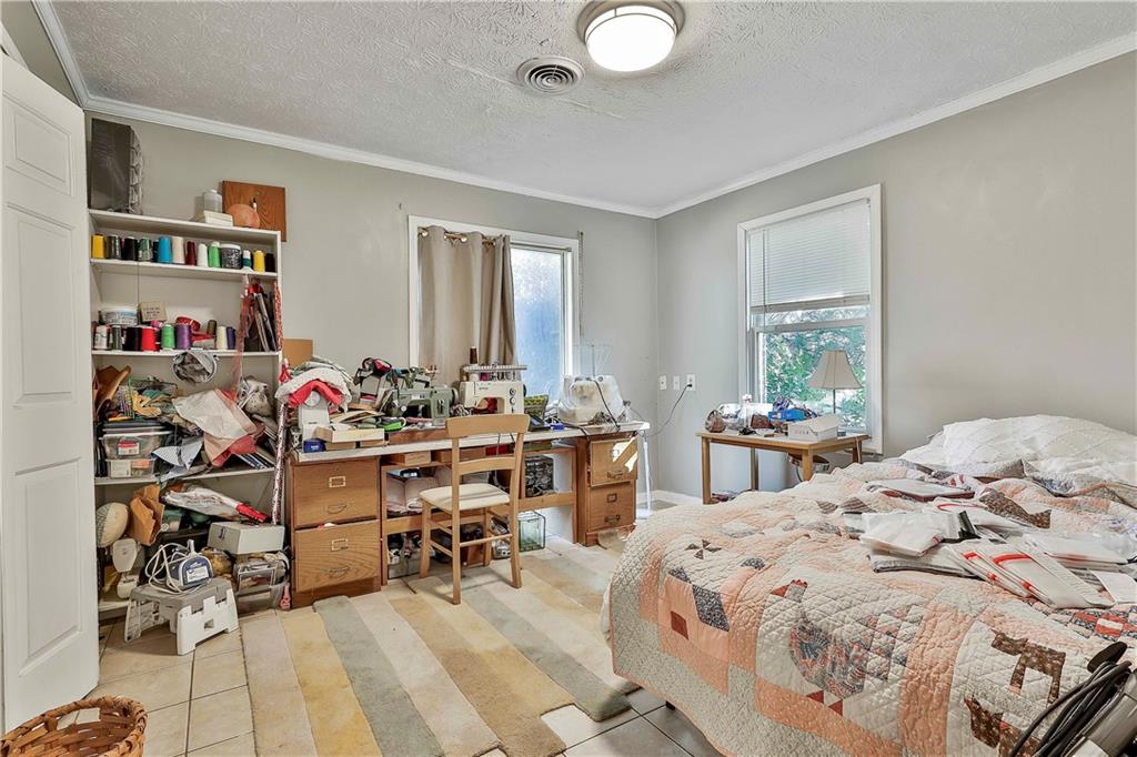 8420 Cleckler Road Palmetto, GA 30268 - Photo 20 of 51 a bed room with a bed and a chair