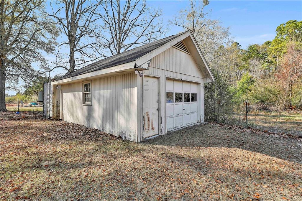 8420 Cleckler Road Palmetto, GA 30268 - Photo 25 of 51 a view of a house with a yard covered in snow