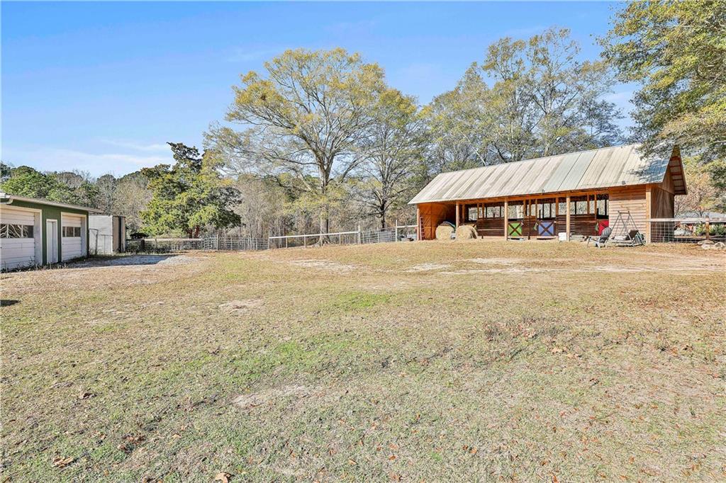8420 Cleckler Road Palmetto, GA 30268 - Photo 36 of 51 a view of a house with a yard