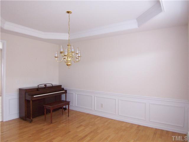 7605 Derek Drive Raleigh, NC 27613 - Photo 5 of 18 a view of a workspace with furniture and a window