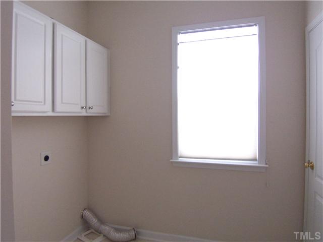 7605 Derek Drive Raleigh, NC 27613 - Photo 8 of 18 a view of a window in an empty room