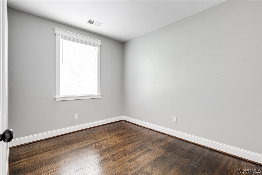 4301 Norborne Road Richmond, VA 23234 - Photo 17 of 29 an empty room with wooden floor and windows