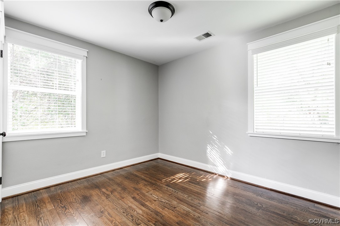 4301 Norborne Road Richmond, VA 23234 - Photo 22 of 29 a view of an empty room with wooden floor and a window