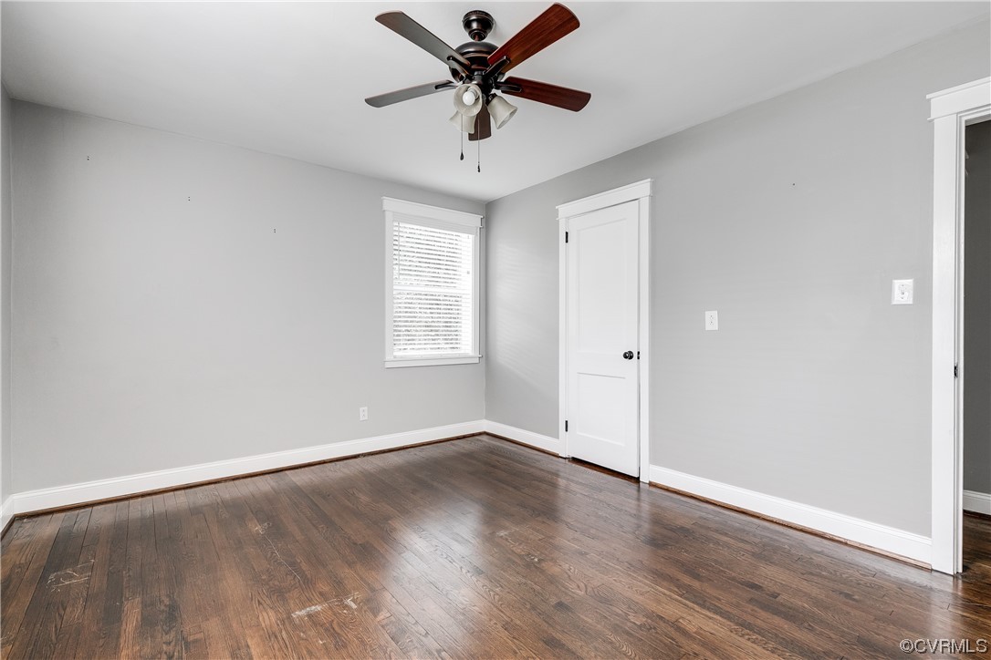 4301 Norborne Road Richmond, VA 23234 - Photo 25 of 29 an empty room with wooden floor fan and windows