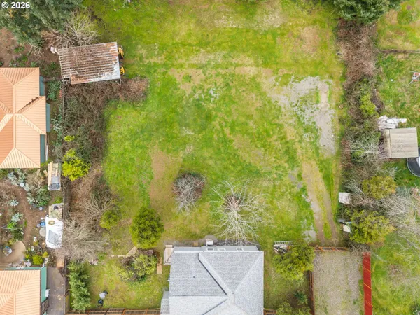 a aerial view of a house with a yard