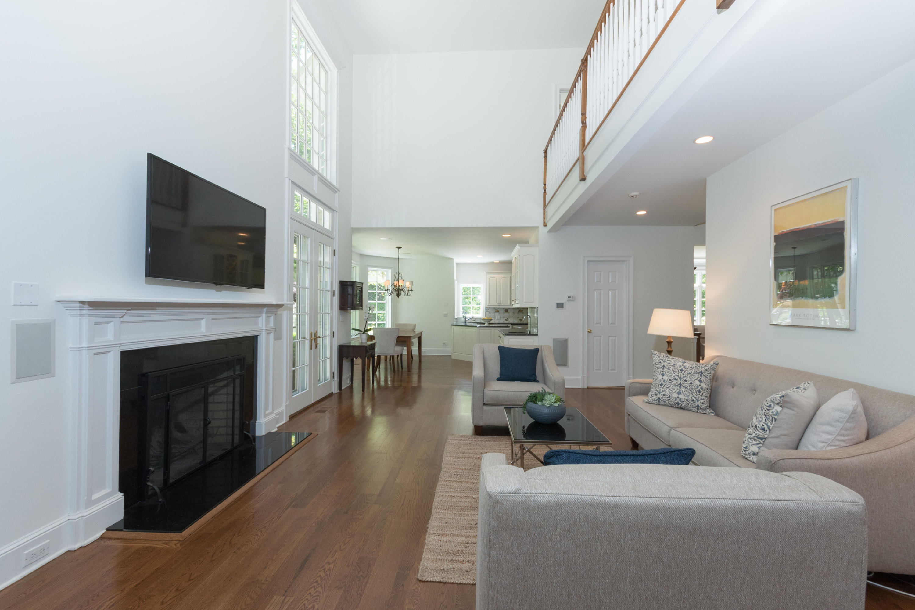 16 Circle Road Darien, CT 06820 - Photo 23 of 49 a living room with furniture a fireplace and a flat screen tv