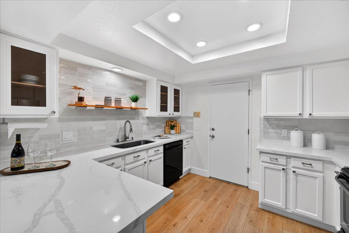 244 Rachael Place Pleasanton, CA 94566 - Photo 8 of 24 a kitchen with stainless steel appliances granite countertop a sink stove and refrigerator