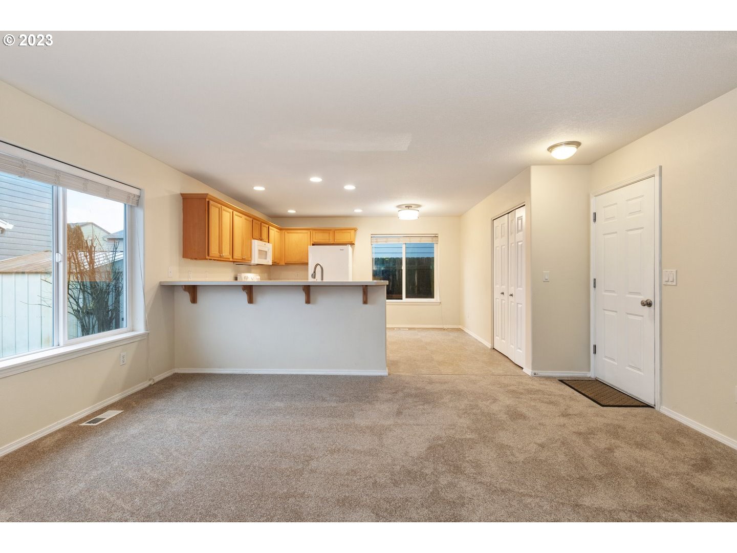 16519 Northeast 12th Avenue Ridgefield, WA 98642 - Photo 11 of 44 a view of a big room with windows and chandelier
