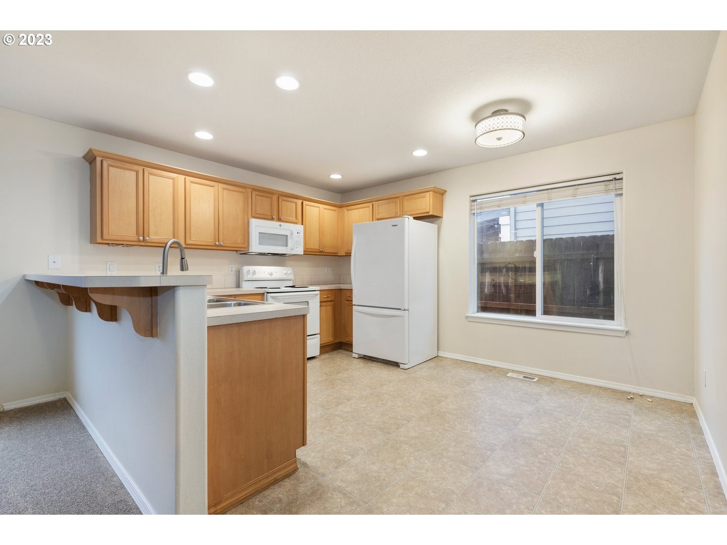 16519 Northeast 12th Avenue Ridgefield, WA 98642 - Photo 12 of 44 a kitchen with refrigerator and cabinets