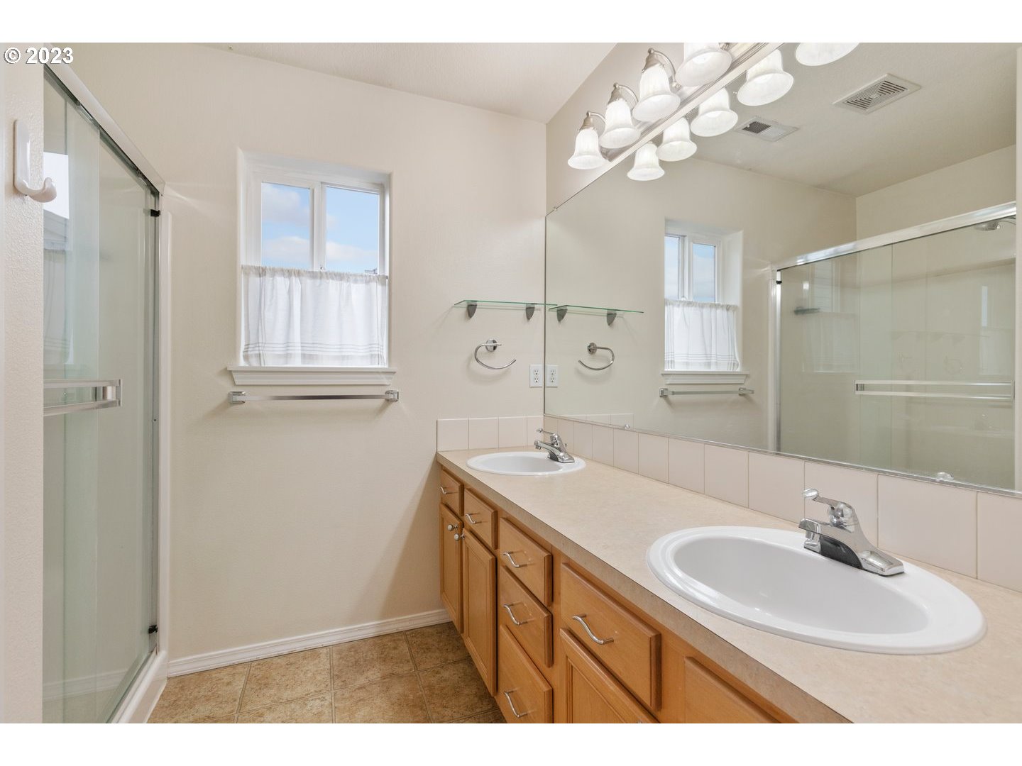 16519 Northeast 12th Avenue Ridgefield, WA 98642 - Photo 23 of 44 a bathroom with a sink vanity granite tub shower and a mirror