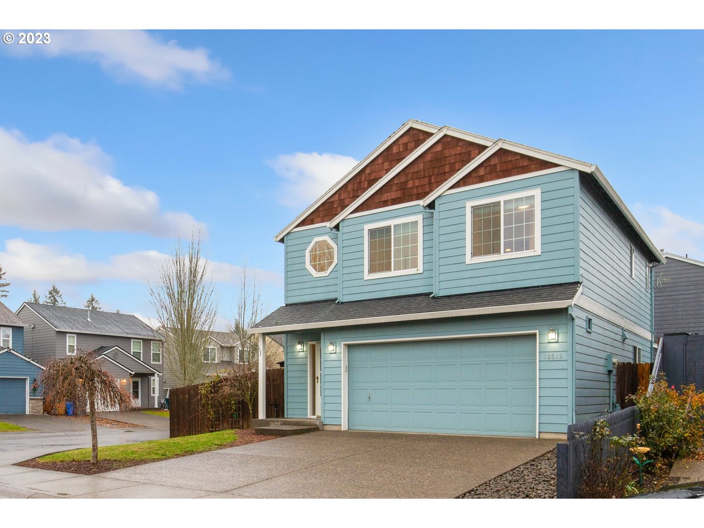 16519 Northeast 12th Avenue Ridgefield, WA 98642 - Photo 3 of 44 a front view of a house with a yard