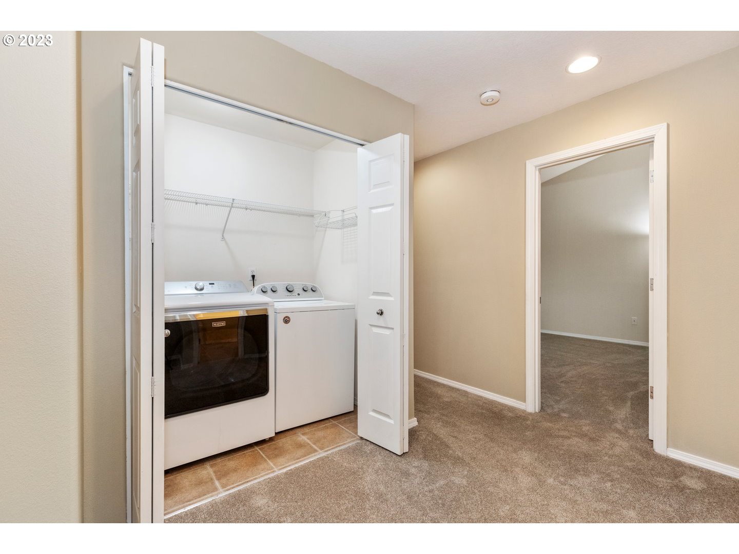 16519 Northeast 12th Avenue Ridgefield, WA 98642 - Photo 34 of 44 a kitchen with stainless steel appliances a stove and a refrigerator