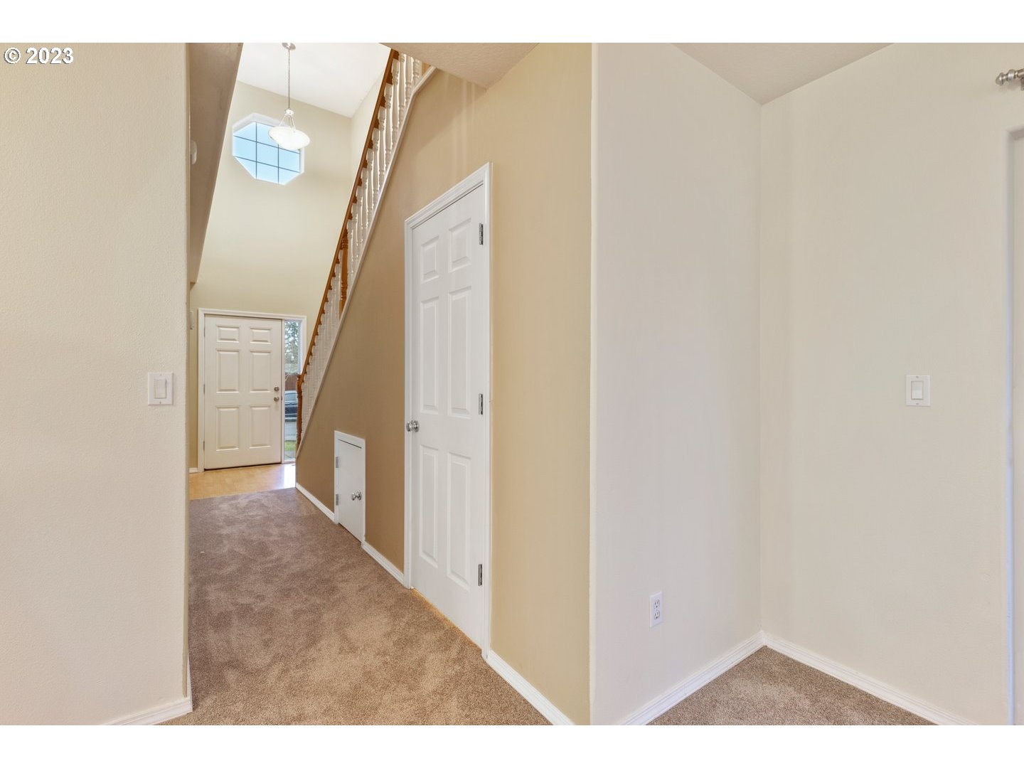 16519 Northeast 12th Avenue Ridgefield, WA 98642 - Photo 4 of 44 a view of a hallway with paintings on the wall