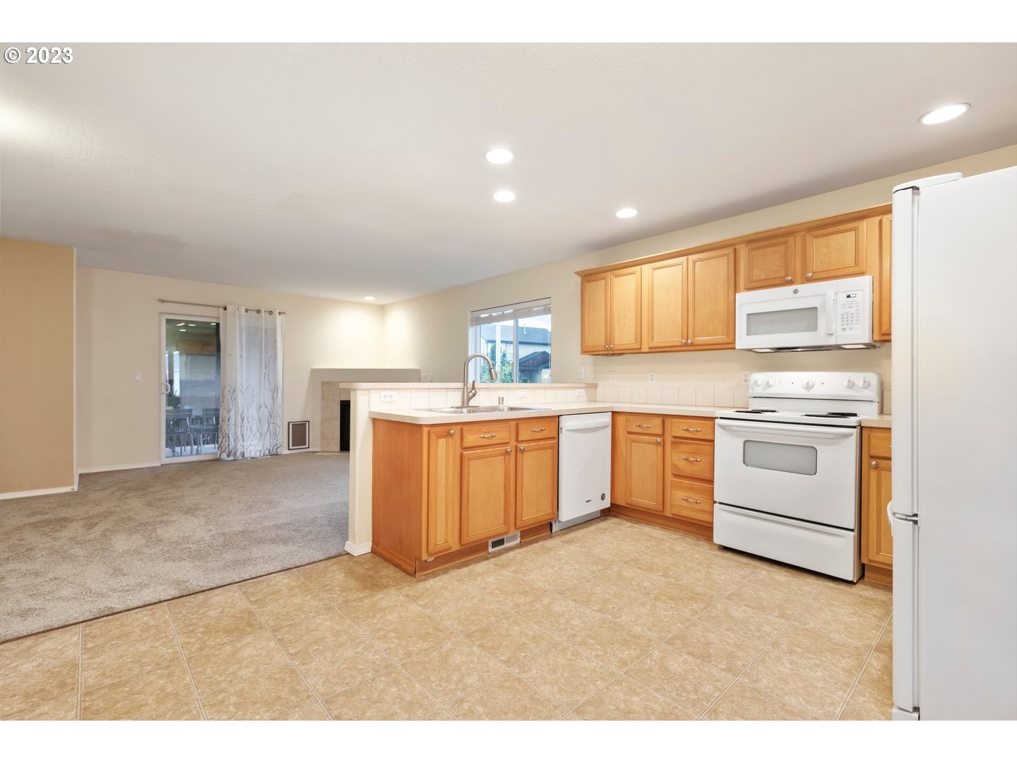 16519 Northeast 12th Avenue Ridgefield, WA 98642 - Photo 10 of 44 a kitchen with a sink stove and cabinets