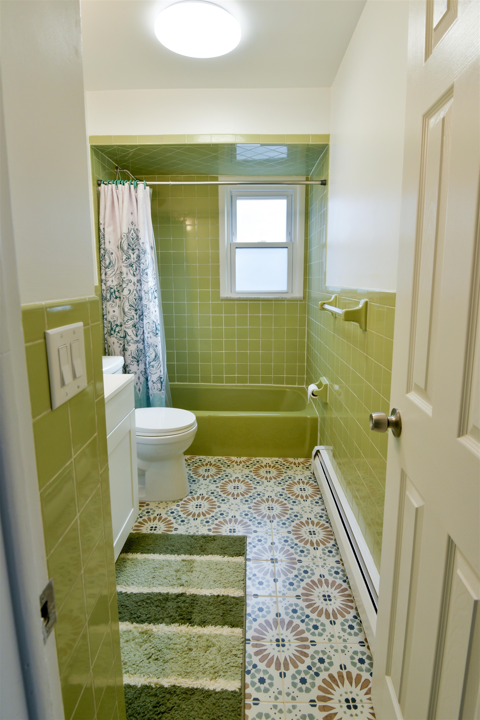 45 East 51st Street Bayonne, NJ 07002 - Photo 13 of 26 a bathroom with a sink and a mirror
